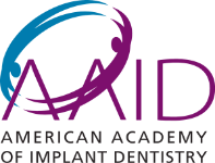 Logo of the American Academy of Implant Dentistry featuring the letters AAID, with blue and purple swoosh graphics above and the full organization name below.